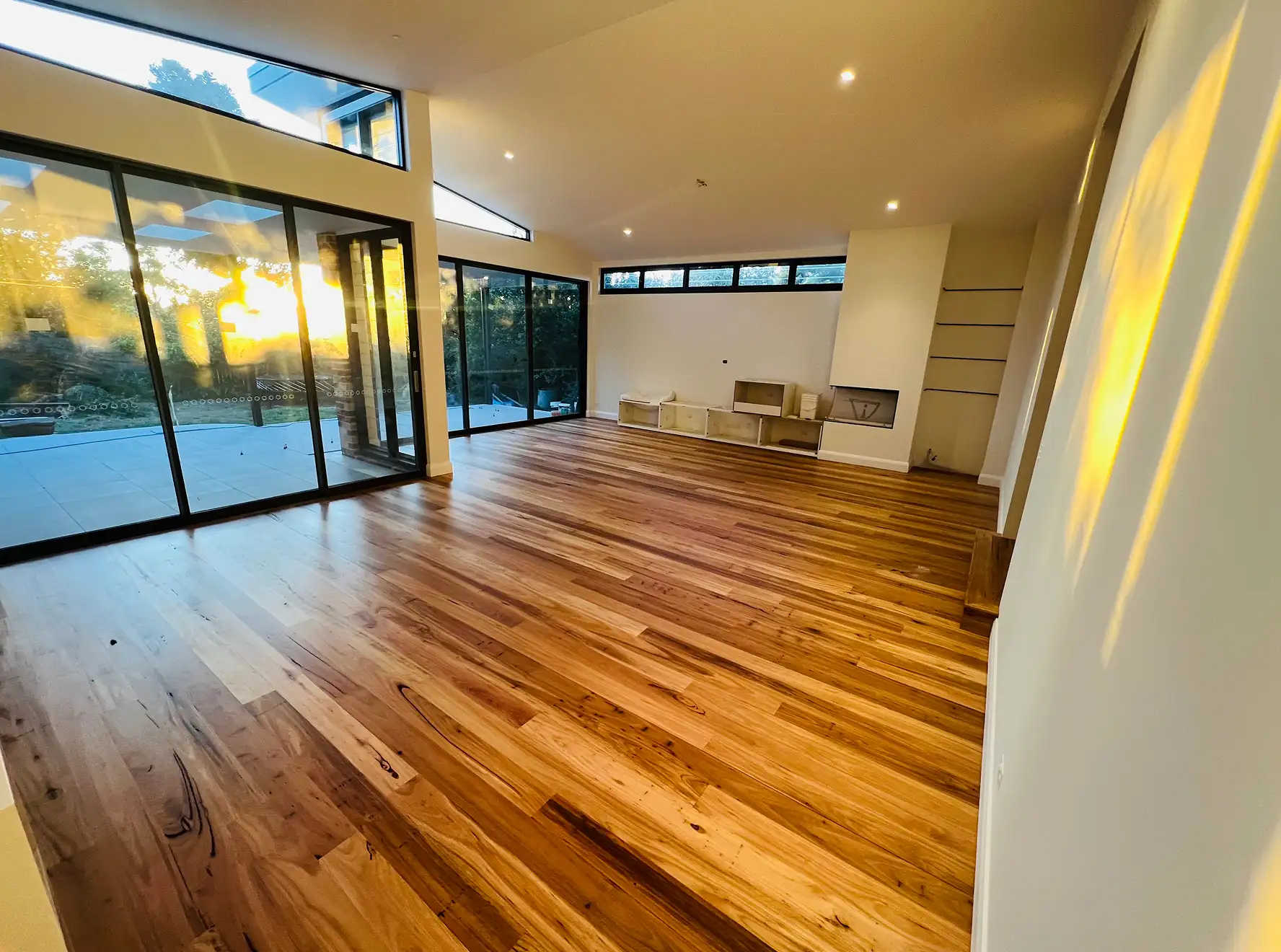 Warm reddish-brown Merbau hardwood floor with natural colour variation in a modern Sydney living space